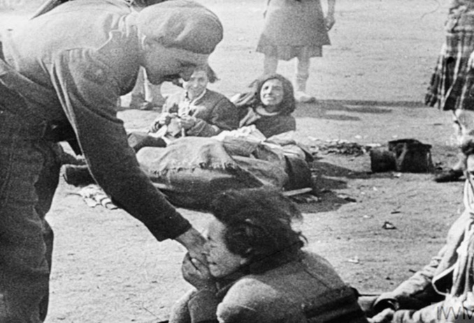 Woman clings to solider at the liberation of Bergen-Belsen